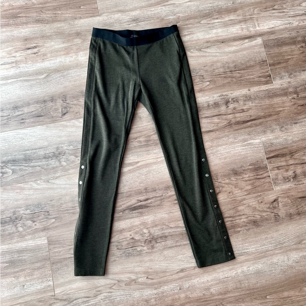 BCBGmaxazria green leggings with black waistband buttons up side ankle hem large